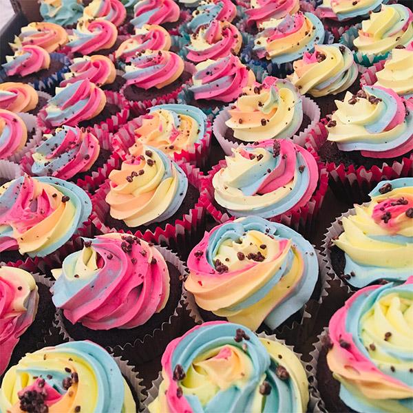 Rainbow swirled buttercream topped cupcakes
