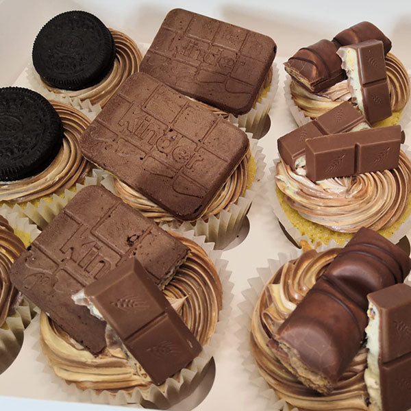 Kinder Cupcakes topped with Oreo Biscuits and Hazelnut buttercream.