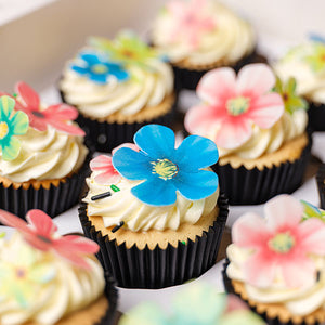 Moana Flower Cupcakes with tropical wafer bright flowers.